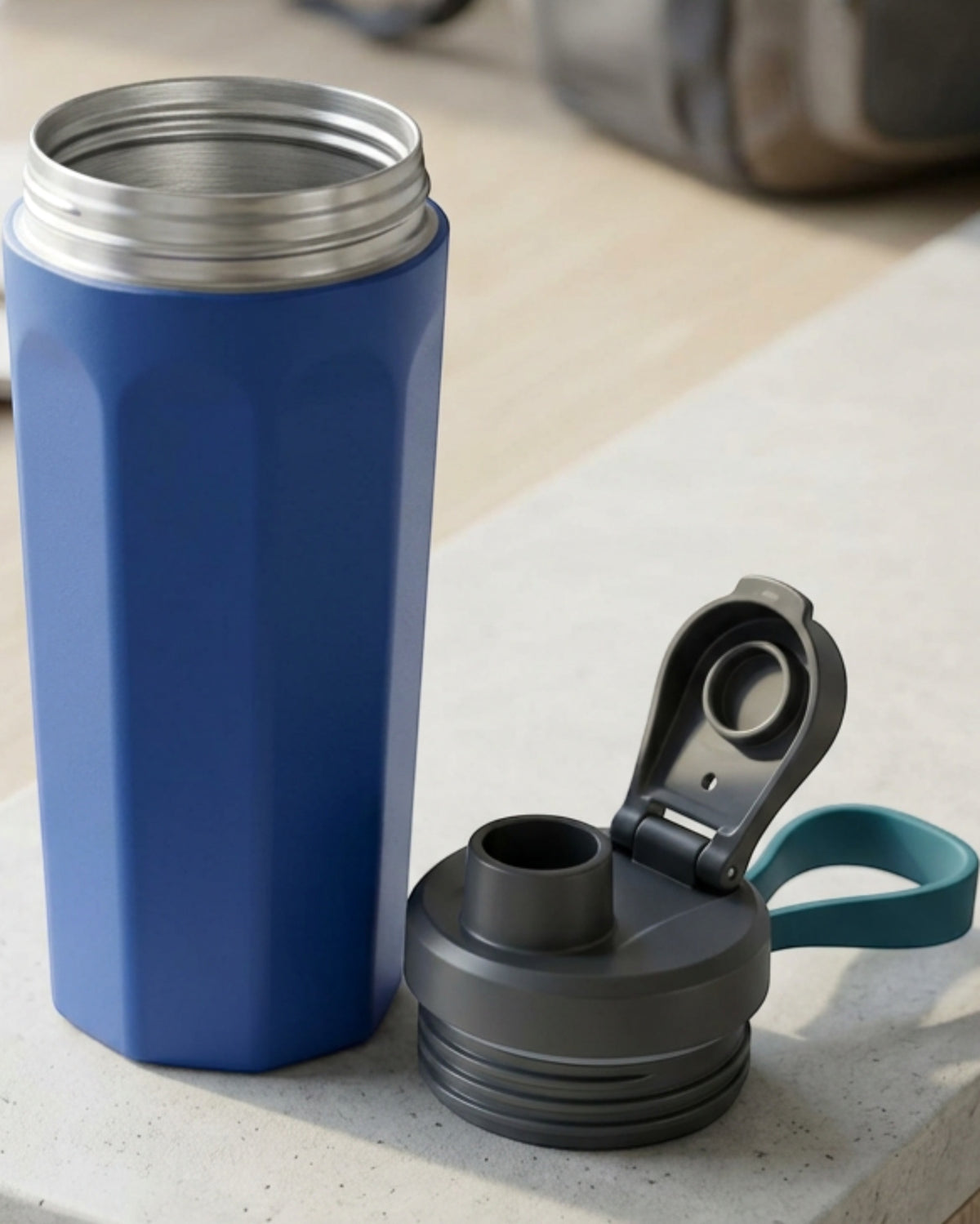 Rcvjn Twenty One Ounce Octagonal Vacuum Tumbler with Flip Spout and Loop Cobalt - Lifestyle view